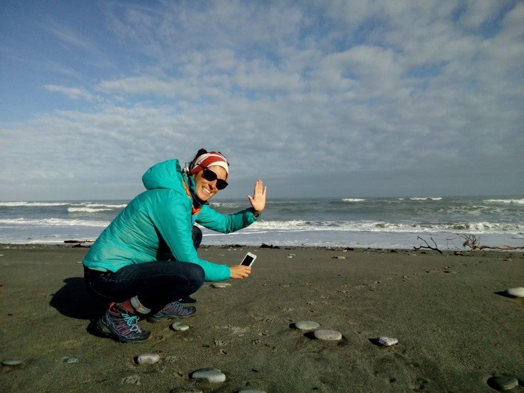 Micaela O'Leary photgraphs penguin footprints and adds straight into the NatureWatch observation on her smart phone