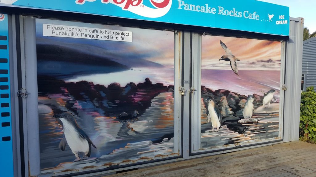 Mark Haldane penguin murals at Pancake Rocks Cafe