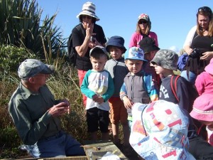 Kids First Paroa with Bill Johnson and a stoat trap Feb 2015 500x